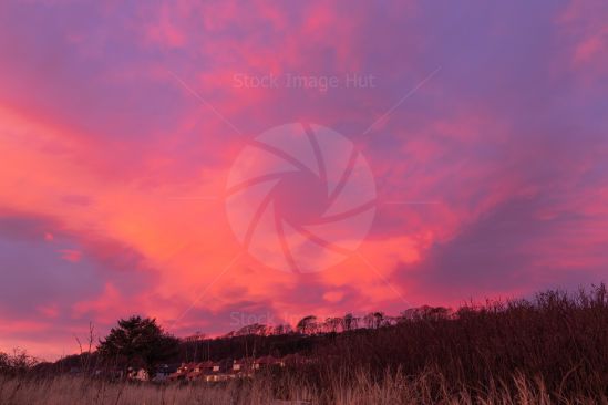 Sun turns sky bright red as she starts to set in Largs, Scotland