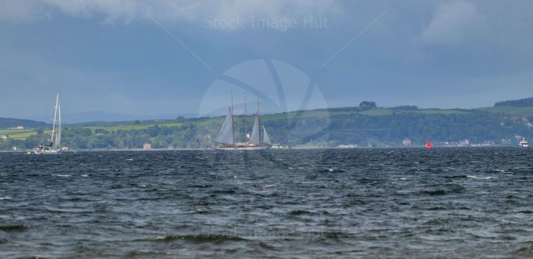 Huge three masted yacht on choppy sea during regatta in Largs 2022