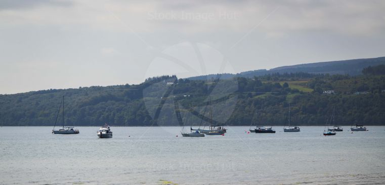 Boats and yachts moored off the coast on the island of Arran, Scotland
