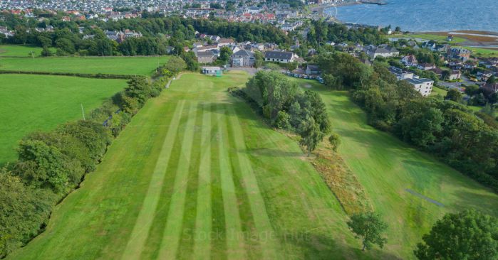 Looking down on a golf course with seaside town of Largs, Scotland in background