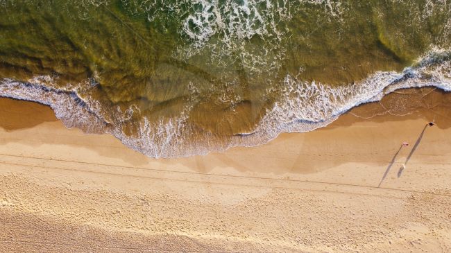 Looking down on beautiful beach from a drone in Queensland, Australia