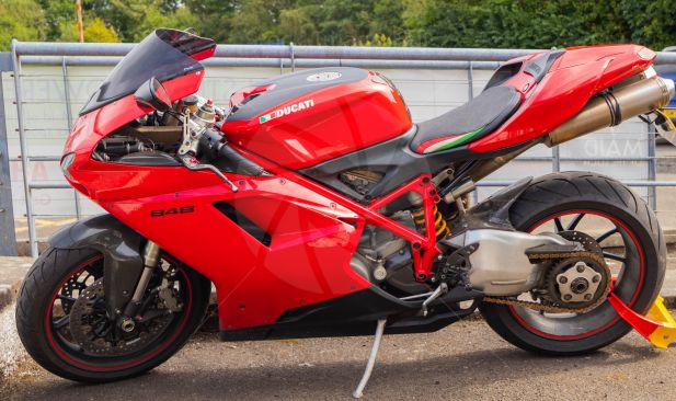 Bright red Ducati motorbike parked at loch Lomond