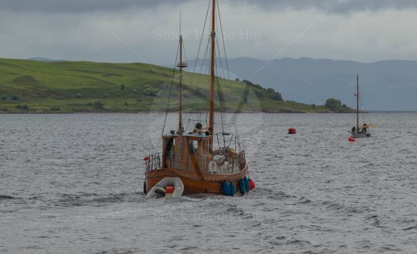 Two very different styles of boats enjoying a day at sea