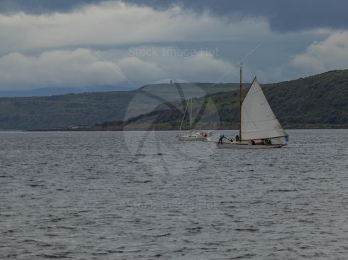 A couple of yachts out at sea enjoying the conditions