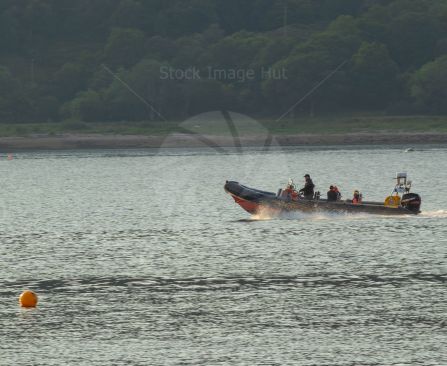 Enjoying a fast ride over the water in a rib