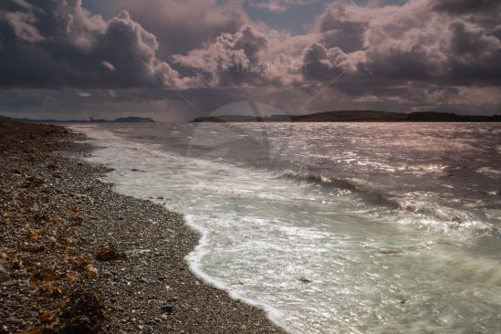 Storm clouds gathering over beach