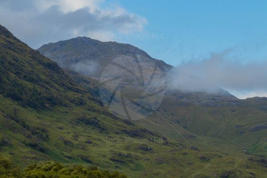 Lingering mist and cloud on Scottish Highlands mountains