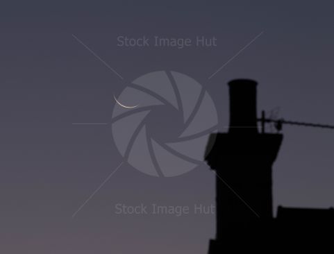 New moon just starting to show on a clear winter night